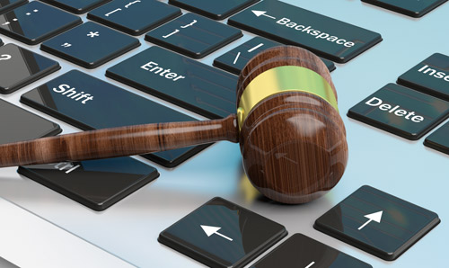 A gavel on a laptop keyboard